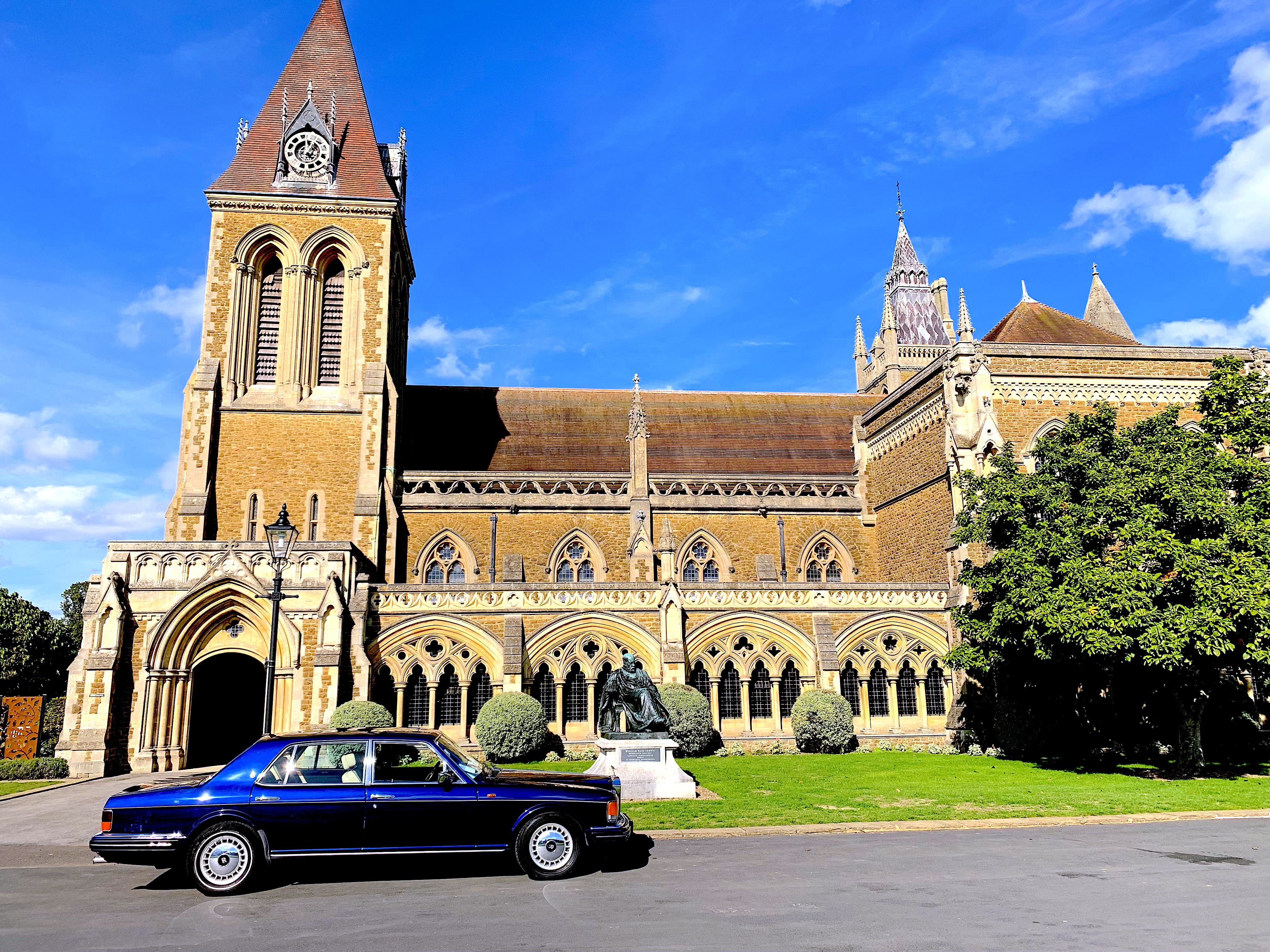 A little car at an old school.