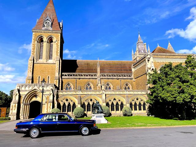 A little car at an old school.