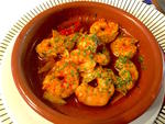 A dish of prawns in garlic and parsley